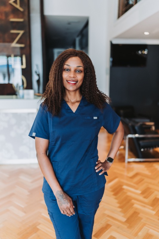 Beatrice consulting with a patient at Brilliance Aesthetics